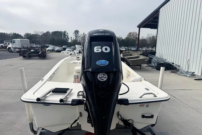 Slide: The Image of 2020 Mako Pro Skiff 15 CC with Mercury 60 engine, parked outdoors. - 3