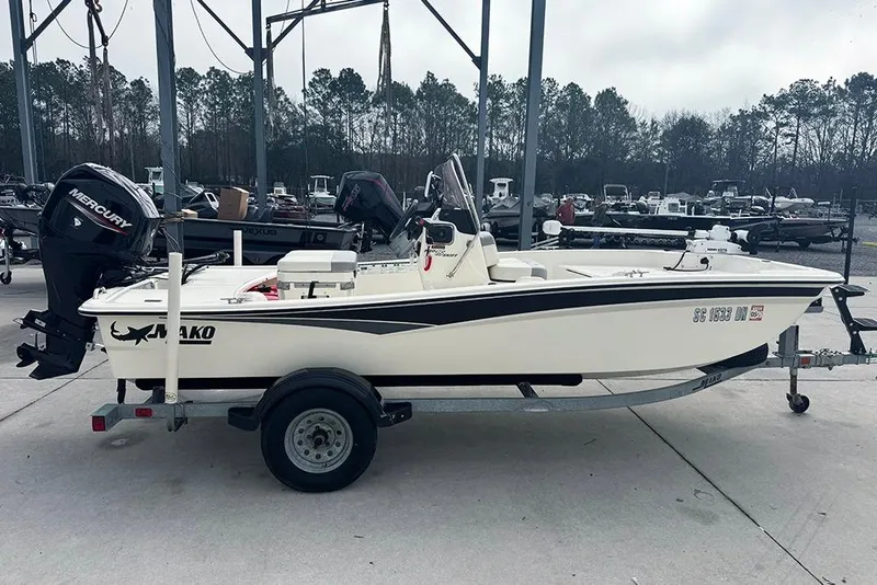 Slide: The Image of 2020 Mako Pro Skiff 15 CC boat on trailer, parked outdoors. - 6