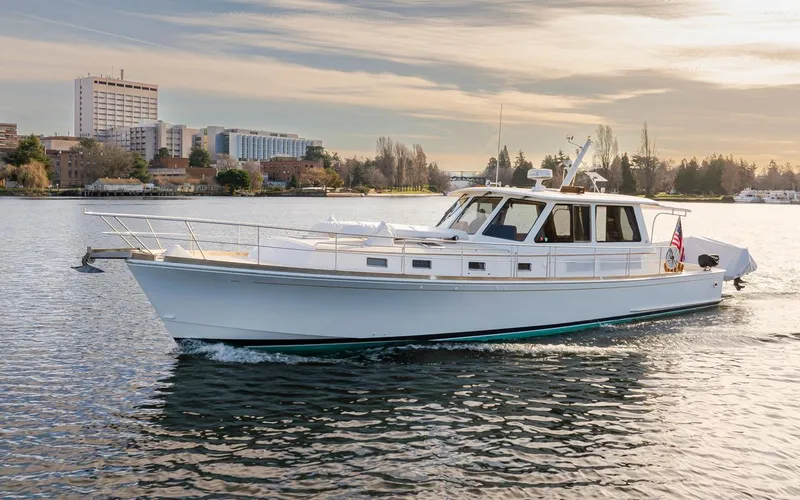 The Image of 2003 Grand Banks 54 Eastbay SX yacht on calm waters. - 0