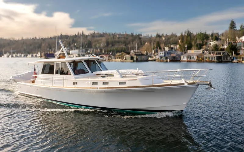 Slide: The Image of 2003 Grand Banks 54 Eastbay SX yacht on calm waters. - 1