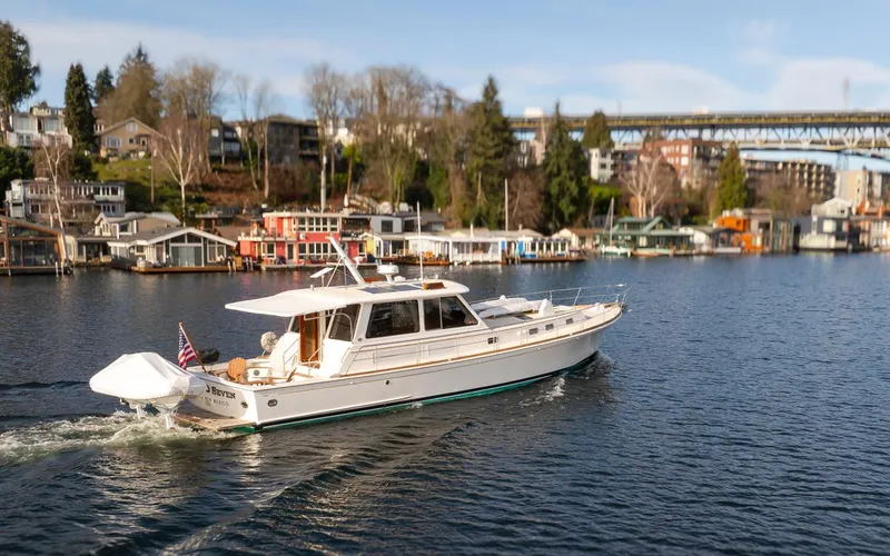 Slide: The Image of 2003 Grand Banks 54 Eastbay SX yacht on calm waters. - 10