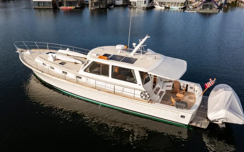 Slide: The Image of 2003 Grand Banks 54 Eastbay SX yacht on calm water. - 11