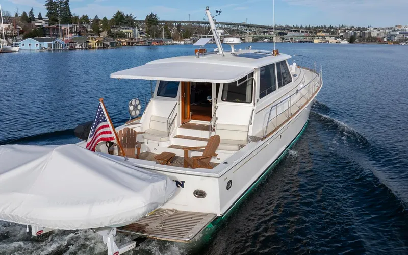 Slide: The Image of 2003 Grand Banks 54 Eastbay SX yacht on calm waters. - 12