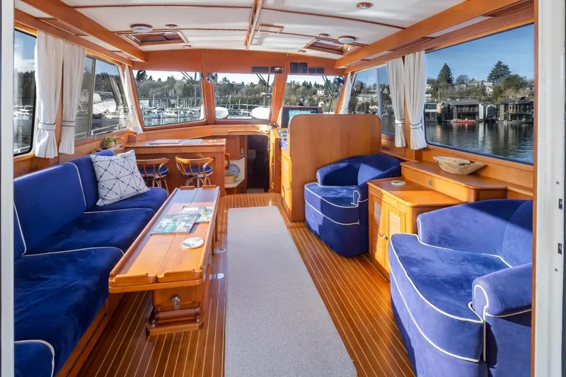 Slide: The Image of Interior of a 2003 Grand Banks 54 Eastbay SX yacht with blue upholstery. - 16
