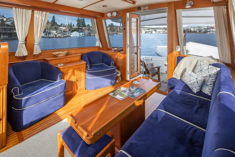 Slide: The Image of Interior of a 2003 Grand Banks 54 Eastbay SX yacht with blue upholstery. - 17