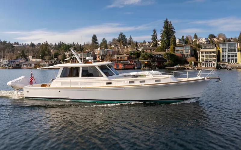 Slide: The Image of 2003 Grand Banks 54 Eastbay SX yacht on calm waters. - 3