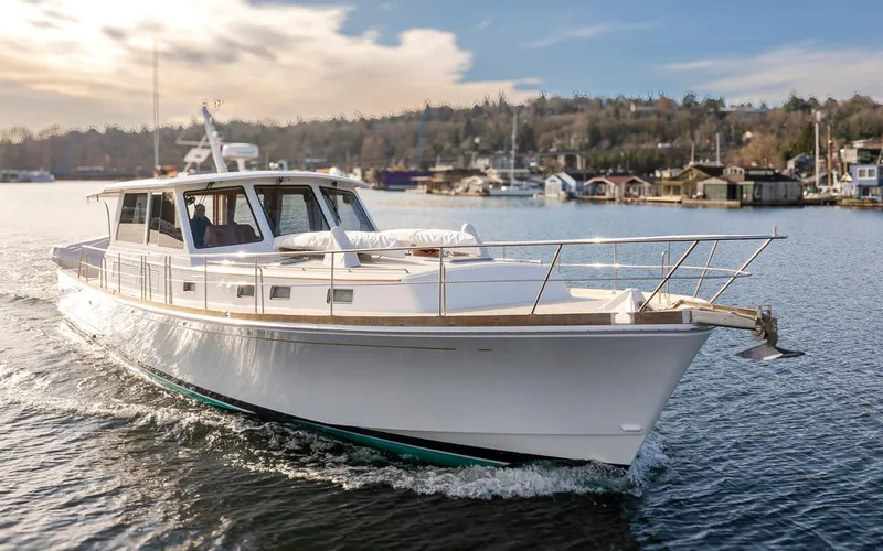 Slide: The Image of Grand Banks 54 Eastbay SX 2003 yacht on calm waters. - 4