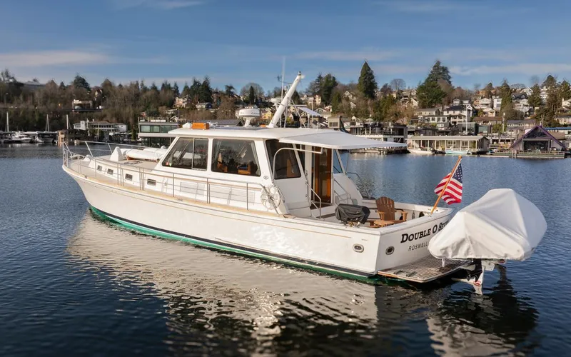 Slide: The Image of 2003 Grand Banks 54 Eastbay SX yacht in harbor. - 46