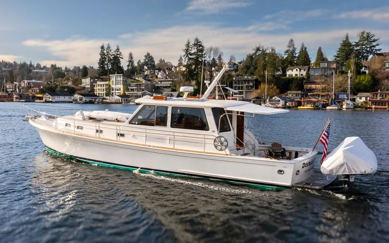 Slide: The Image of 2003 Grand Banks 54 Eastbay SX yacht on calm water. - 47