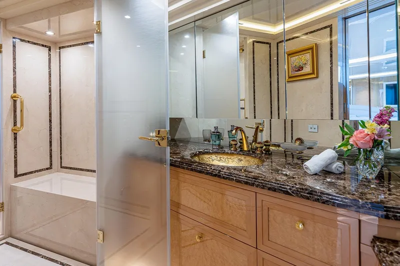 Slide: The Image of Luxurious bathroom on 2017 Sanlorenzo SD112 yacht with marble countertop and gold fixtures. - 15