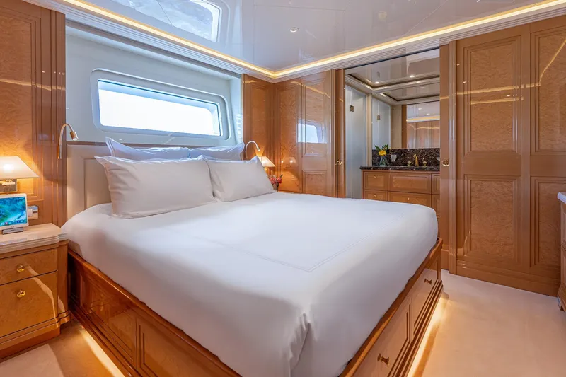 Slide: The Image of Luxurious bedroom interior on 2017 Sanlorenzo SD112 yacht, featuring elegant wood finishes and modern amenities. - 21