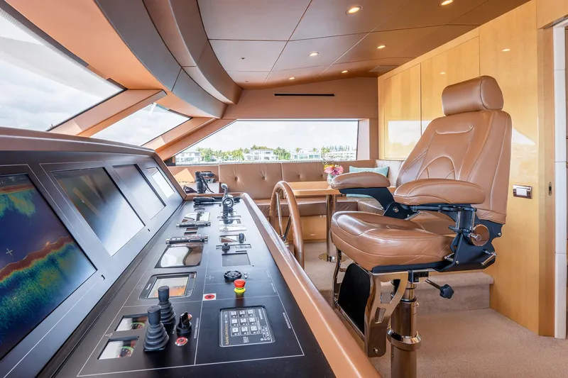 Slide: The Image of Luxurious helm of 2017 Sanlorenzo SD112 yacht with leather captain's chair and advanced controls. - 28