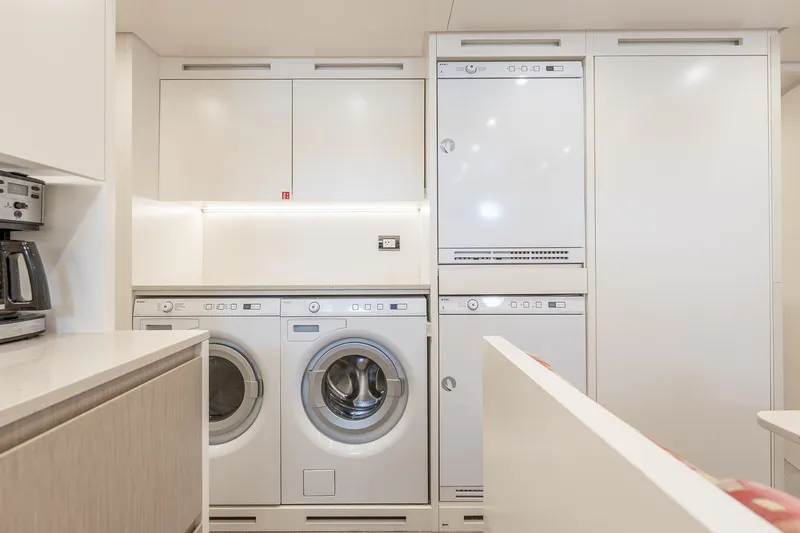 Slide: The Image of Laundry area on 2017 Sanlorenzo SD112 yacht with modern appliances and sleek cabinetry. - 45