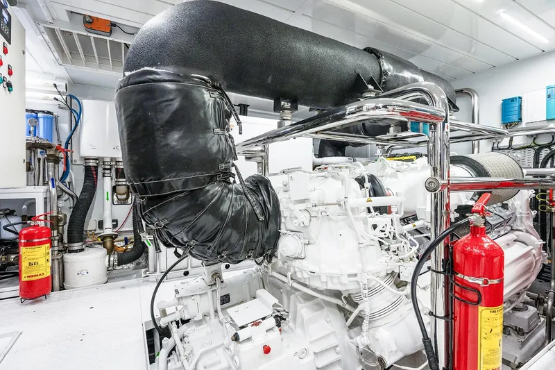 Slide: The Image of Engine room of 2017 Sanlorenzo SD112 yacht with fire extinguishers and machinery. - 52
