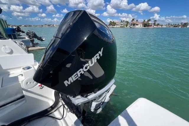 Slide: The Image of 2023 Beneteau Antares 8 with Mercury outboard engine on scenic water. - 15