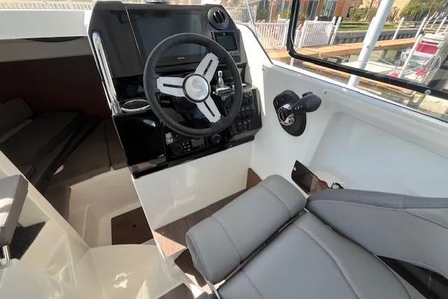 Slide: The Image of 2023 Beneteau Antares 8 cockpit with modern steering and comfortable seating. - 17