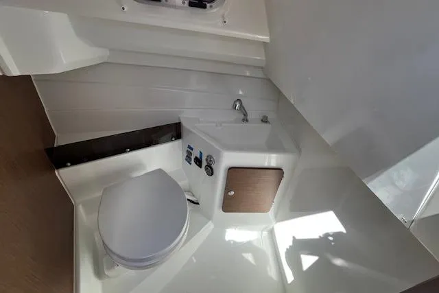 Slide: The Image of 2023 Beneteau Antares 8 boat bathroom with compact sink and toilet. - 8