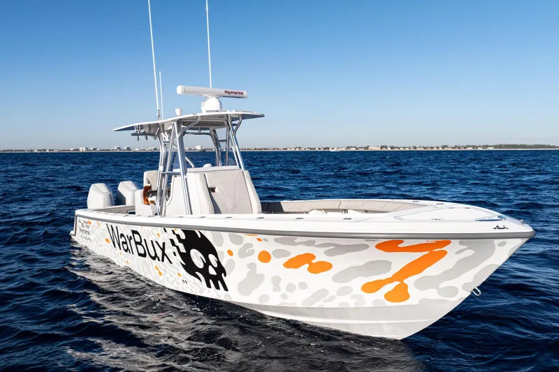 Slide: The Image of 2026 SeaVee 320B boat on open water, featuring custom graphics and sleek design. - 10