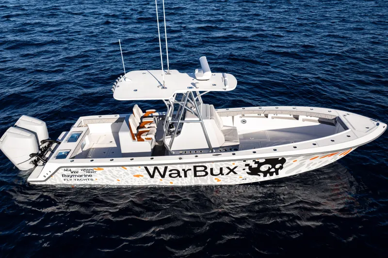 Slide: The Image of 2026 SeaVee 320B boat on ocean, featuring "WarBux" design and dual engines. - 11