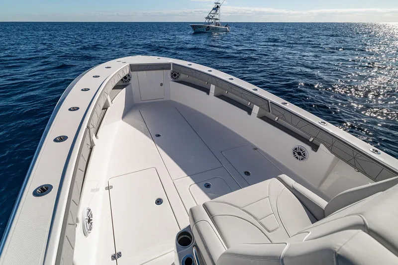 Slide: The Image of 2026 SeaVee 320B boat on open ocean, showcasing spacious deck and seating. - 13