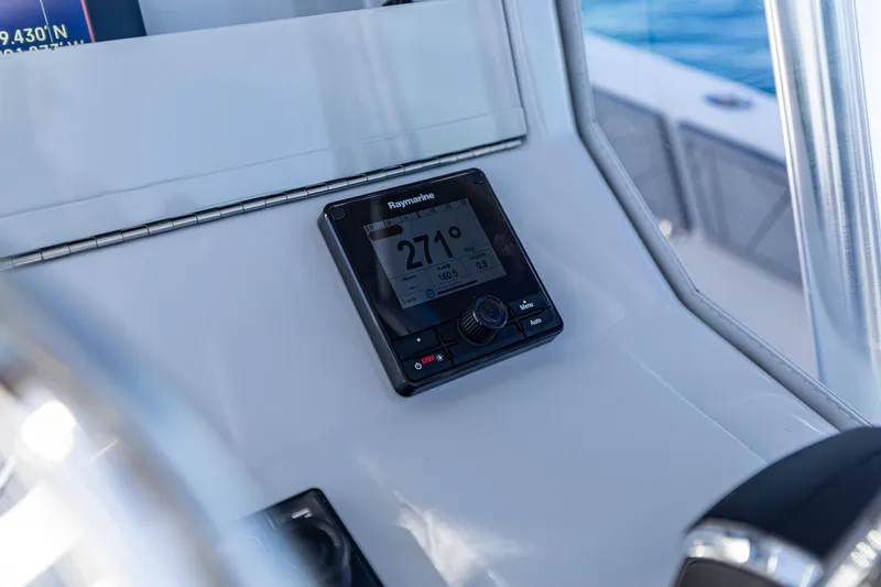 Slide: The Image of Raymarine navigation display on 2026 SeaVee 320B boat dashboard. - 24