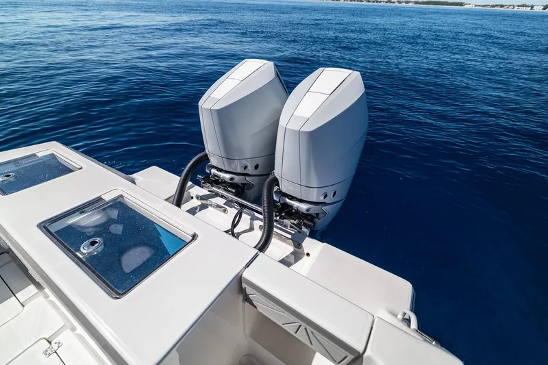 Slide: The Image of 2026 SeaVee 320B boat with dual outboard engines on open water. - 25