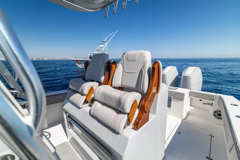 Slide: The Image of 2026 SeaVee 320B boat interior with luxurious seating and ocean view. - 33