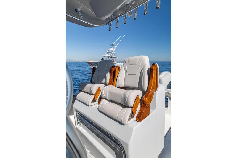 Slide: The Image of Luxurious seating on 2026 SeaVee 320B boat, featuring elegant design and ocean backdrop. - 34