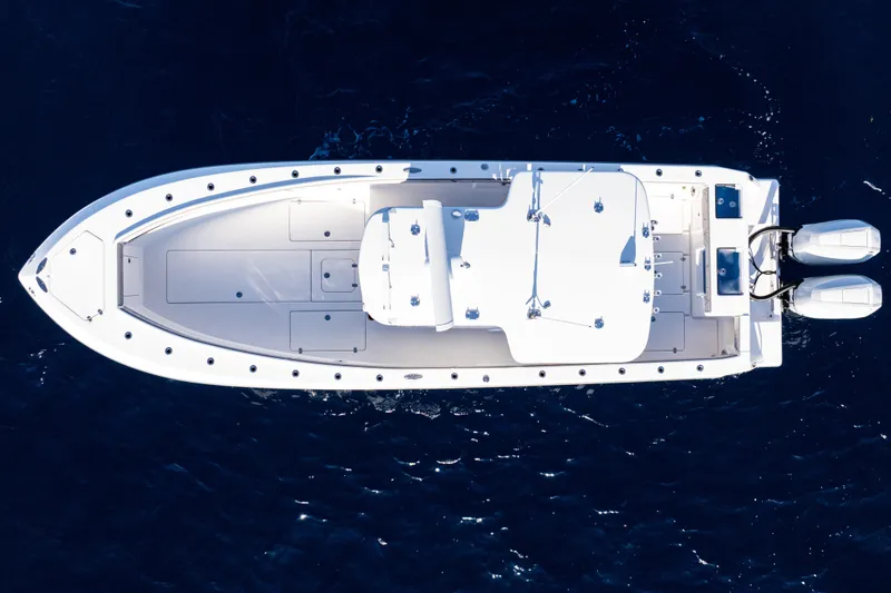 Slide: The Image of 2026 SeaVee 320B boat on open water, featuring dual outboard engines. - 4