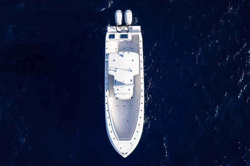 Slide: The Image of Top view of 2026 SeaVee 320B boat with dual outboard motors on open water. - 6