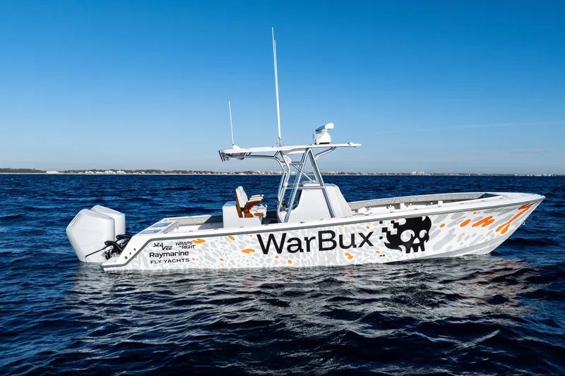 Slide: The Image of 2026 SeaVee 320B boat on ocean, featuring custom "WarBux" design and advanced equipment. - 8