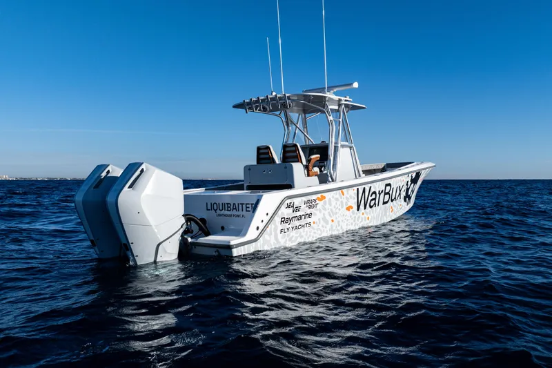 Slide: The Image of 2026 SeaVee 320B boat on open water, featuring dual engines and custom graphics. - 9