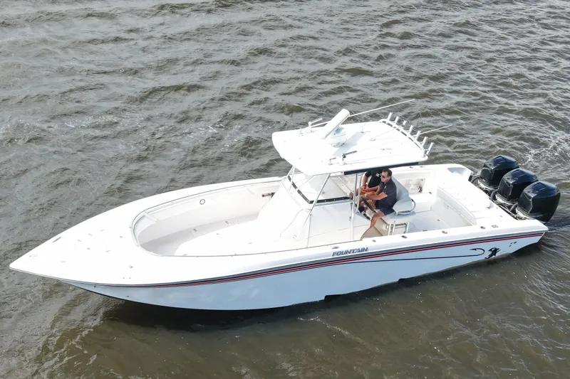 Slide: The Image of 2005 Fountain 34 Tournament Edition boat cruising on open water. - 10