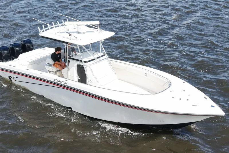Slide: The Image of 2005 Fountain 34 Tournament Edition boat cruising on open water. - 11