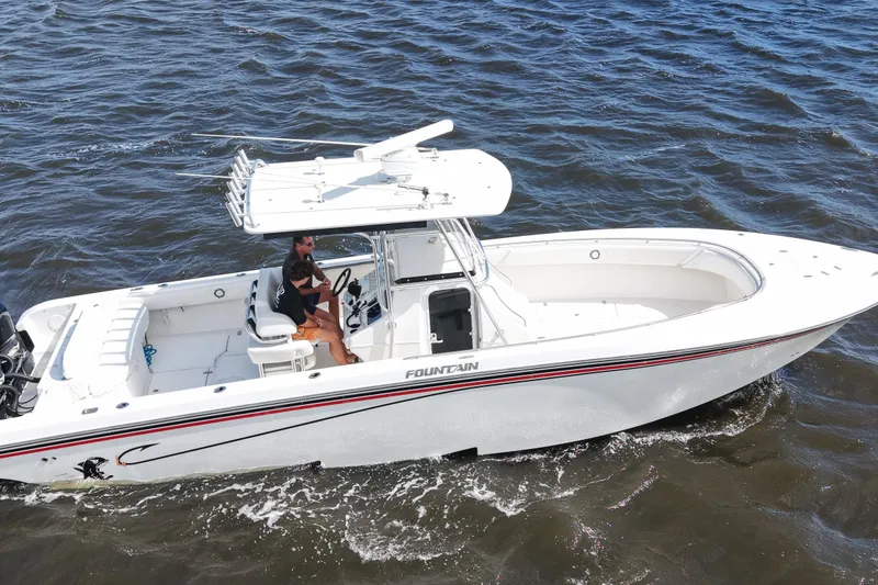 Slide: The Image of 2005 Fountain 34 Tournament Edition boat cruising on open water. - 12