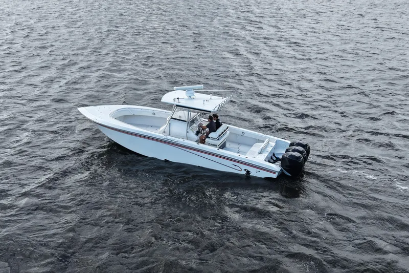 Slide: The Image of 2005 Fountain 34 Tournament Edition boat cruising on open water. - 14