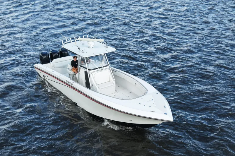 Slide: The Image of 2005 Fountain 34 Tournament Edition boat cruising on open water. - 15