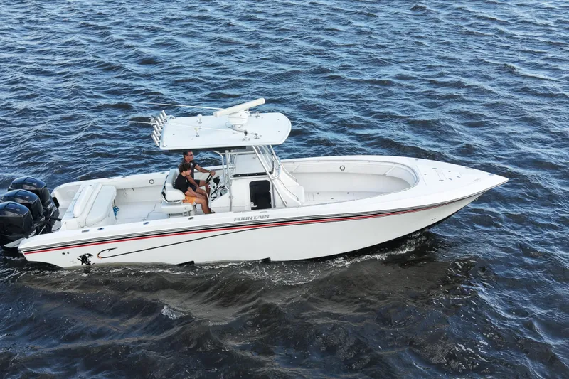 Slide: The Image of 2005 Fountain 34 Tournament Edition boat cruising on open water. - 16