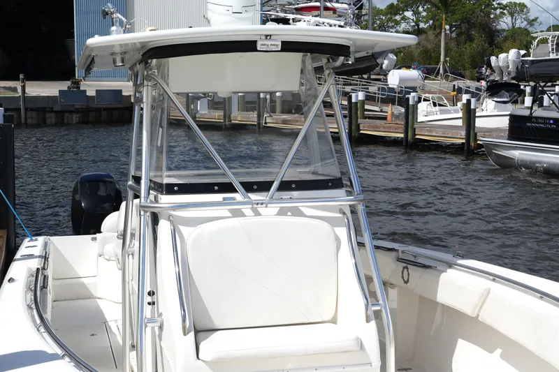 Slide: The Image of 2005 Fountain 34 Tournament Edition boat docked at marina, featuring sleek design and spacious seating. - 17