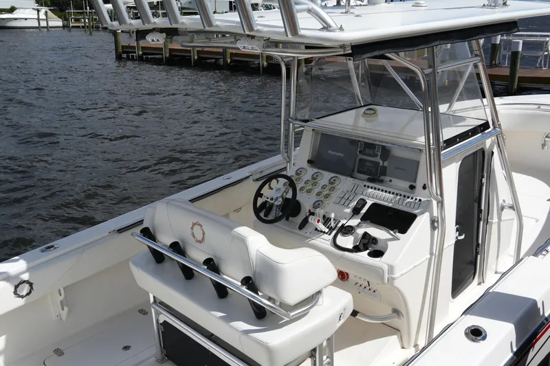 Slide: The Image of 2005 Fountain 34 Tournament Edition boat cockpit with advanced navigation controls and seating. - 19