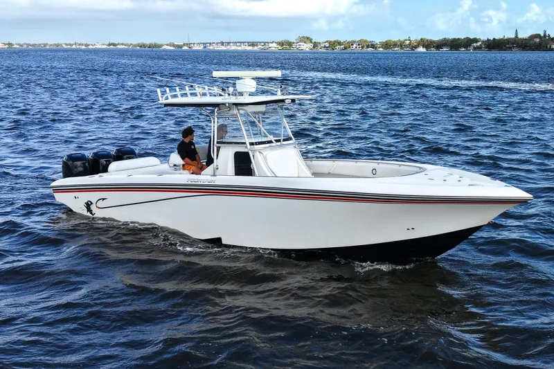Slide: The Image of 2005 Fountain 34 Tournament Edition boat cruising on open water. - 2