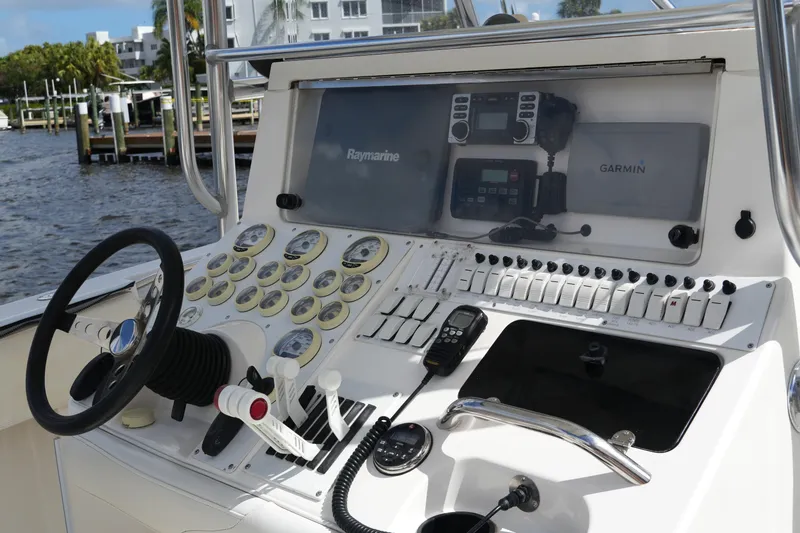 Slide: The Image of Control panel of a 2005 Fountain 34 Tournament Edition boat with navigation equipment. - 24