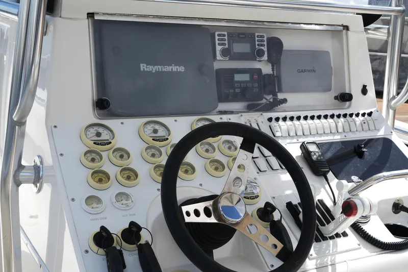 Slide: The Image of Control panel of a 2005 Fountain 34 Tournament Edition boat with navigation equipment. - 25