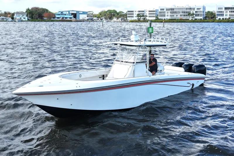 Slide: The Image of 2005 Fountain 34 Tournament Edition boat on water, featuring sleek design and powerful engines. - 3