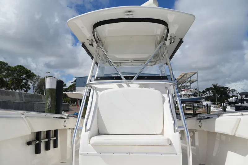 Slide: The Image of 2005 Fountain 34 Tournament Edition boat at dock, featuring sleek design and spacious seating. - 35