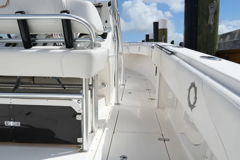 Slide: The Image of 2005 Fountain 34 Tournament Edition boat interior with white seating and stainless steel accents. - 36