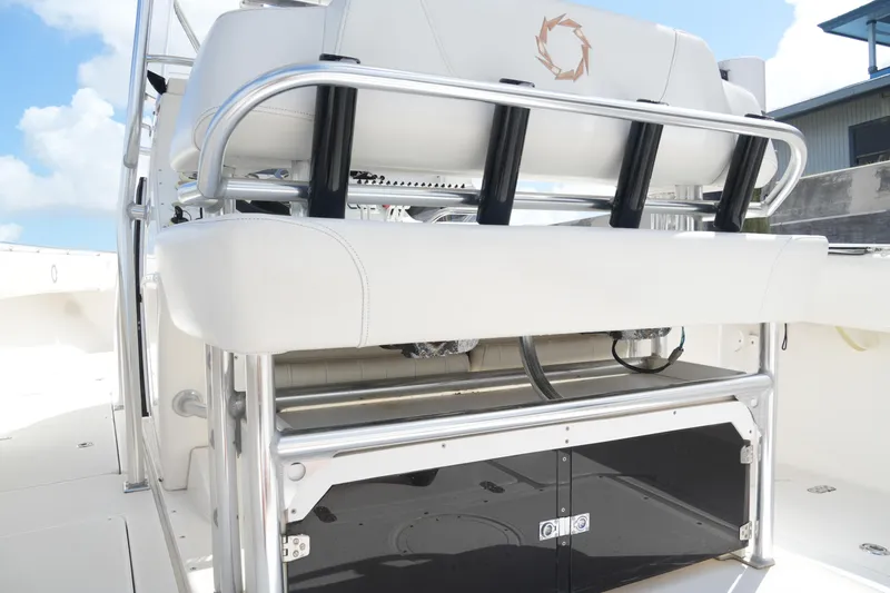 Slide: The Image of 2005 Fountain 34 Tournament Edition boat interior with white seating and stainless steel accents. - 38