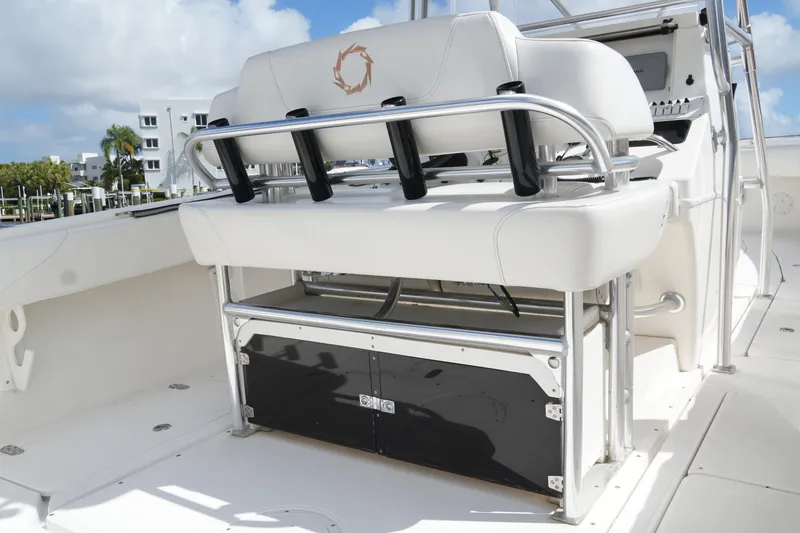 Slide: The Image of 2005 Fountain 34 Tournament Edition boat interior with white seating and stainless steel frame. - 39