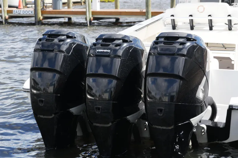 Slide: The Image of Triple outboard engines on a 2005 Fountain 34 Tournament Edition boat at dock. - 42
