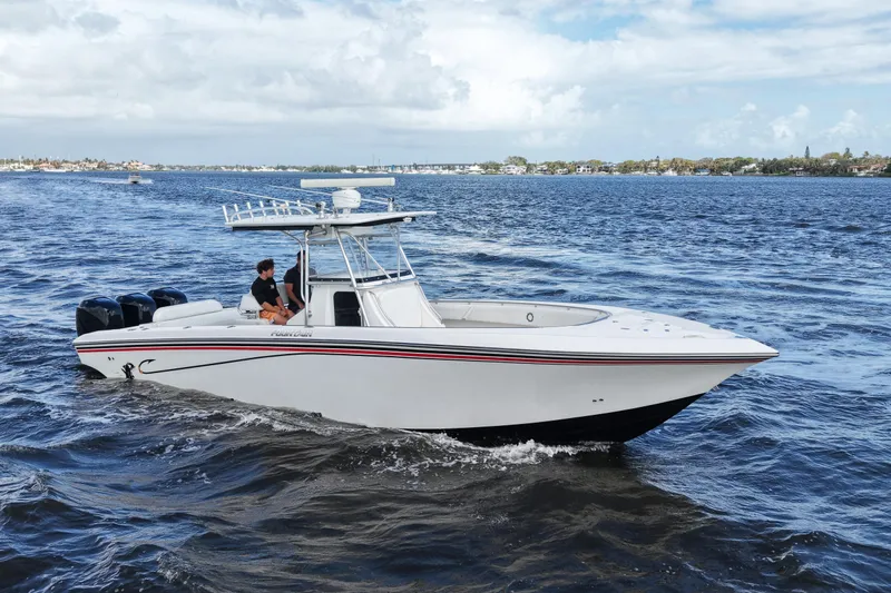 Slide: The Image of 2005 Fountain 34 Tournament Edition boat cruising on open water. - 5